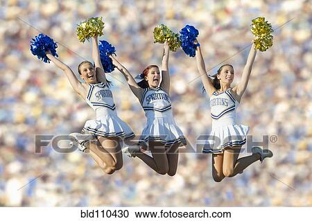 Caucasian cheerleaders jumping in mid-air View Large Photo Image Stock Image - Caucasian cheerleaders jumping in mid-air. Fotosearch