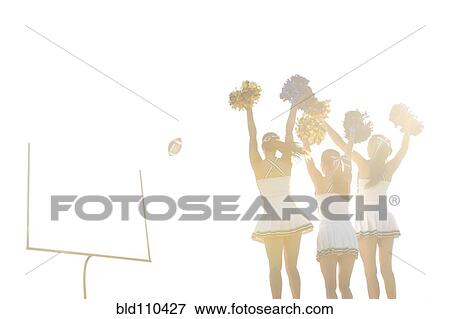 Stock Photo - Caucasian cheerleaders on sidelines at football game. Fotosearch