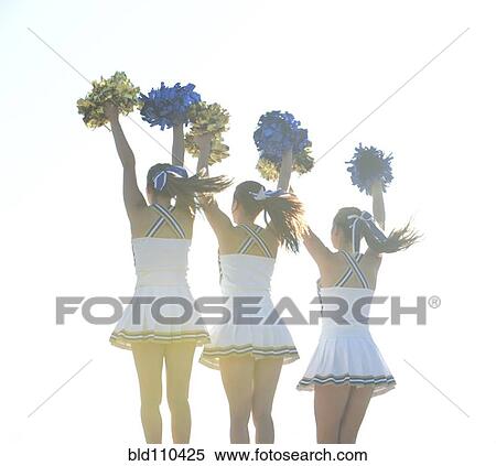 Stock Photography - Caucasian cheerleaders posing together. Fotosearch
