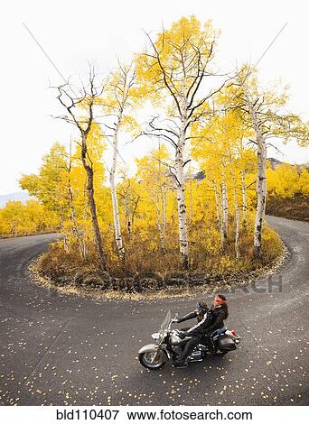 Caucasian couple riding motorcycle View Large Photo Image Stock Photo - Caucasian couple riding motorcycle. Fotosearch