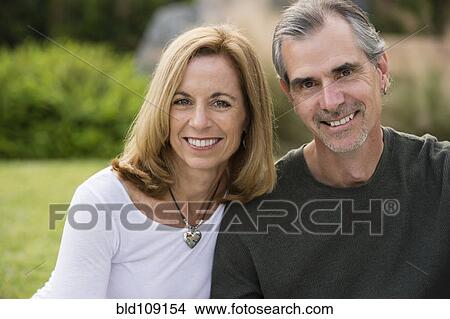 Caucasian couple smiling outdoors View Large Photo Image Picture - Caucasian couple smiling outdoors. Fotosearch