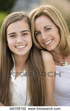 Caucasian mother and daughter smiling outdoors View Large Photo Image Stock Image - Caucasian mother and daughter smiling outdoors. Fotosearch