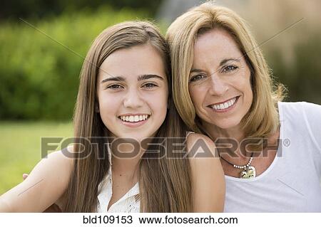 Caucasian mother and daughter smiling outdoors View Large Photo Image Stock Image - Caucasian mother and daughter smiling outdoors. Fotosearch