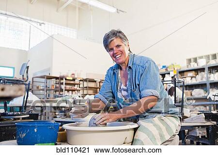 Caucasian sculptor working in studio View Large Photo Image Stock Image - Caucasian sculptor working in studio. Fotosearch