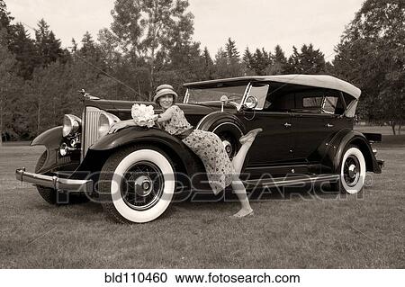 Caucasian woman on vintage car View Large Photo Image Stock Image - Caucasian woman on vintage car. Fotosearch