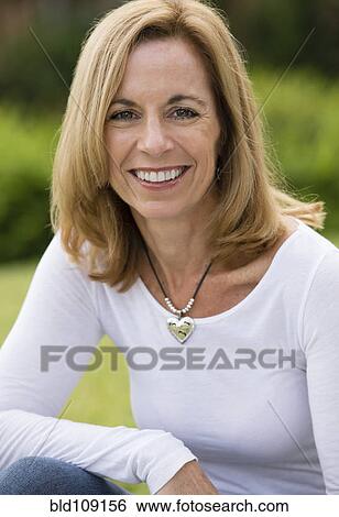 Stock Photograph - Caucasian woman smiling outdoors. Fotosearch