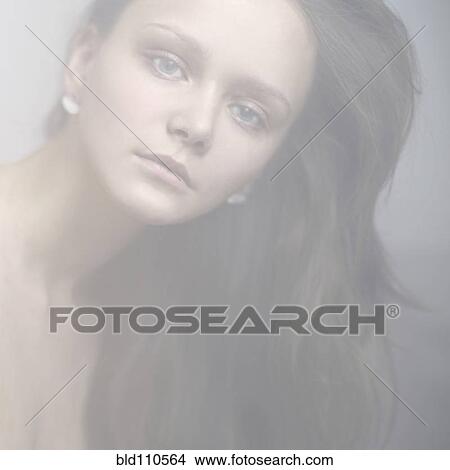 Picture - Caucasian woman with serious expression. Fotosearch