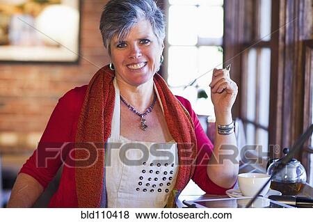Caucasian woman working in coffee shop View Large Photo Image Stock Photo - Caucasian woman working in coffee shop. Fotosearch