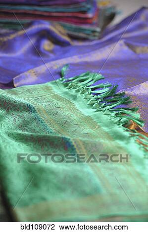 Stock Image - Close up of bright woven textiles. Fotosearch