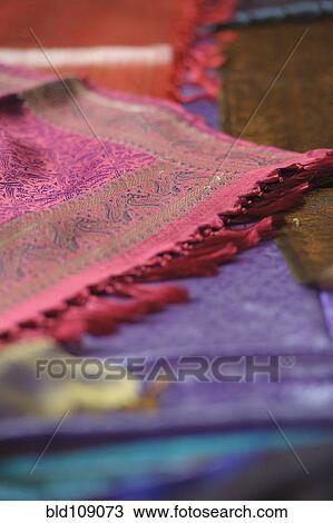 Stock Image - Close up of bright woven textiles. Fotosearch