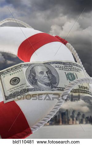 Stock Image - Dollar bill attached to life preserver. Fotosearch