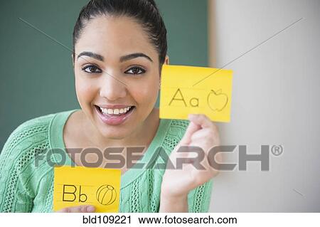 Hispanic teacher using flash cards View Large Photo Image Stock Image - Hispanic teacher using flash cards. Fotosearch