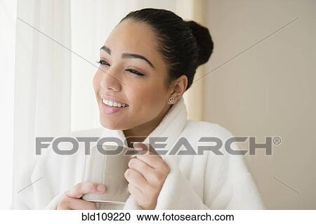 Hispanic woman drinking cup of coffee View Large Photo Image Stock Image - Hispanic woman drinking cup of coffee. Fotosearch