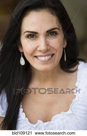 Stock Image - Hispanic woman smiling. Fotosearch