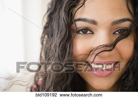 Stock Image - Hispanic woman smiling. Fotosearch