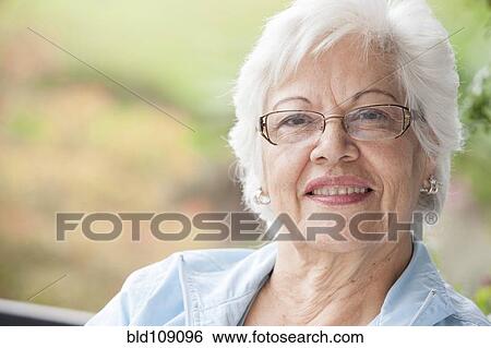 Stock Photograph - Hispanic woman smiling. Fotosearch