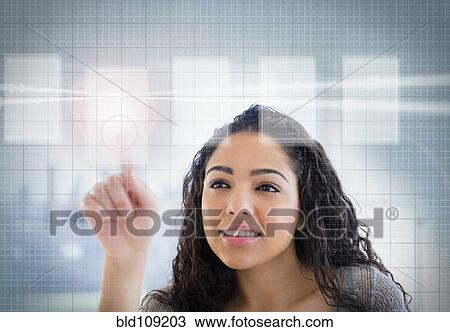 Hispanic woman using touch screen View Large Photo Image Stock Image - Hispanic woman using touch screen. Fotosearch