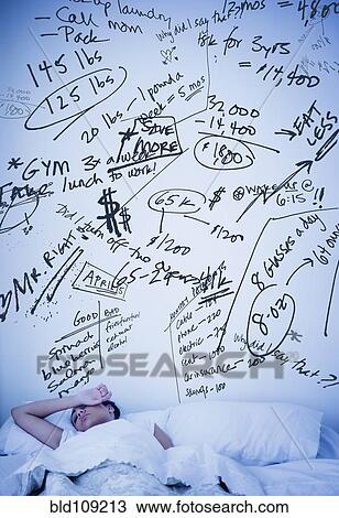 Stock Image - Hispanic woman with scribbled worries over bed. Fotosearch