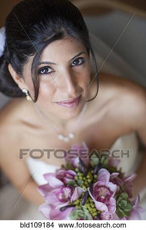 Lebanese bride holding bouquet View Large Photo Image Picture - Lebanese bride holding bouquet. Fotosearch