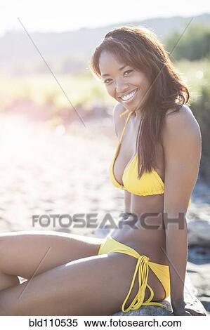 Mixed race woman in bikini on beach View Large Photo Image Stock Photography - Mixed race woman in bikini on beach. Fotosearch
