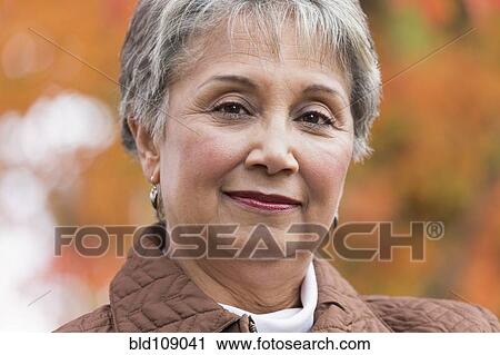 Stock Image - Mixed race woman smiling. Fotosearch