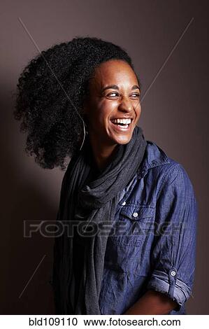 Stock Image - Mixed race woman smiling. Fotosearch