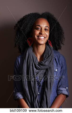 Stock Photo - Mixed race woman smiling. Fotosearch