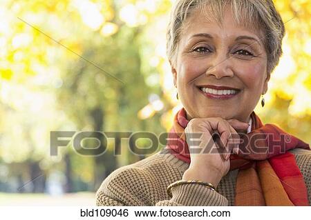 Stock Photograph - Mixed race woman smiling. Fotosearch