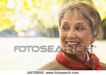 Stock Photography - Mixed race woman smiling. Fotosearch