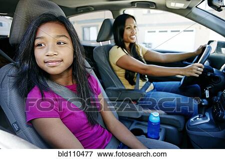 Mother and daughter driving in car View Large Photo Image Stock Photo - Mother and daughter driving in car. Fotosearch