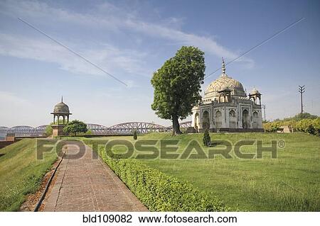 Stock Image - Ornate building with grass lawn. Fotosearch