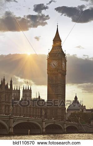 Stock Image - Sunbeams on Big Ben clock tower. Fotosearch