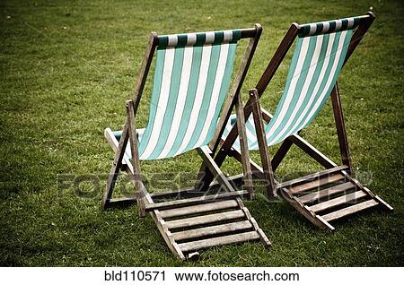 Two law chairs on grass View Large Photo Image Stock Image - Two law chairs on grass. Fotosearch