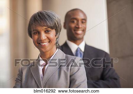 Stock Image - Black business people smiling. Fotosearch
