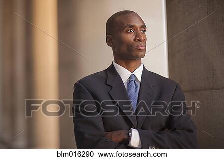 Stock Image - Black businessman outdoors. Fotosearch