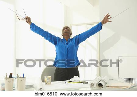Stock Image - Black businesswoman cheering. Fotosearch