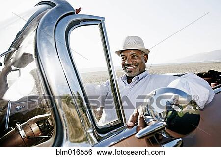 Black man driving convertible View Large Photo Image Stock Photograph - Black man driving convertible. Fotosearch