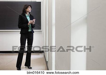 Stock Image - Caucasian businesswoman using cell phone. Fotosearch