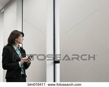 Caucasian businesswoman using cell phone View Large Photo Image Stock Image - Caucasian businesswoman using cell phone. Fotosearch
