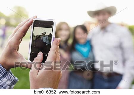 Caucasian friends taking pictures together View Large Photo Image Stock Image - Caucasian friends taking pictures together. Fotosearch