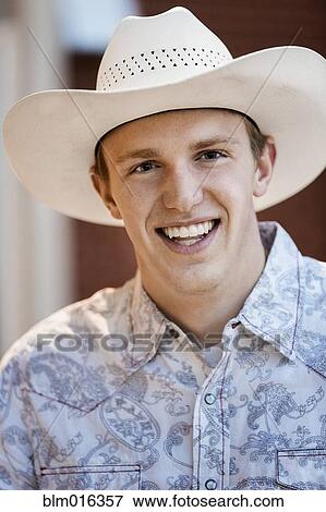Caucasian man wearing cowboy hat View Large Photo Image Stock Photo - Caucasian man wearing cowboy hat. Fotosearch