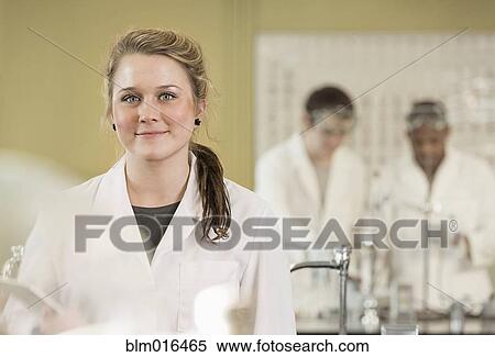 Caucasian student smiling in lab classroom View Large Photo Image Stock Photography - Caucasian student smiling in lab classroom. Fotosearch
