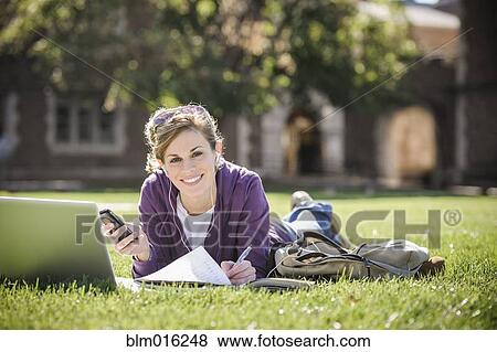 Stock Photo - Caucasian student studying on campus. Fotosearch