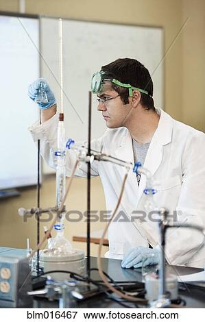 Caucasian student working in lab classroom View Large Photo Image Stock Photo - Caucasian student working in lab classroom. Fotosearch