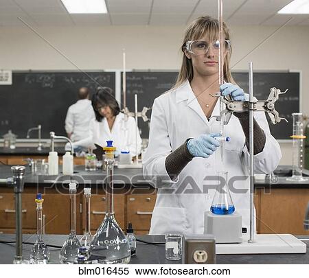 Stock Photography - Caucasian student working in lab classroom. Fotosearch