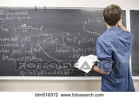 Caucasian student writing on blackboard View Large Photo Image Stock Image - Caucasian student writing on blackboard. Fotosearch
