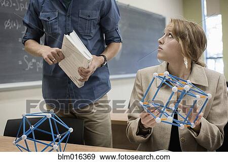 Stock Photo - Caucasian students working in classroom. Fotosearch