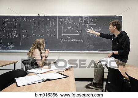 Caucasian students working in classroom View Large Photo Image Stock Photograph - Caucasian students working in classroom. Fotosearch
