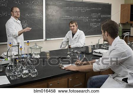 Caucasian students working in lab classroom View Large Photo Image Stock Photo - Caucasian students working in lab classroom. Fotosearch