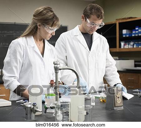 Stock Photograph - Caucasian students working in lab classroom. Fotosearch